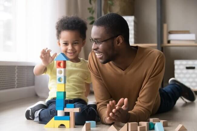 dad with his son playing with blocks